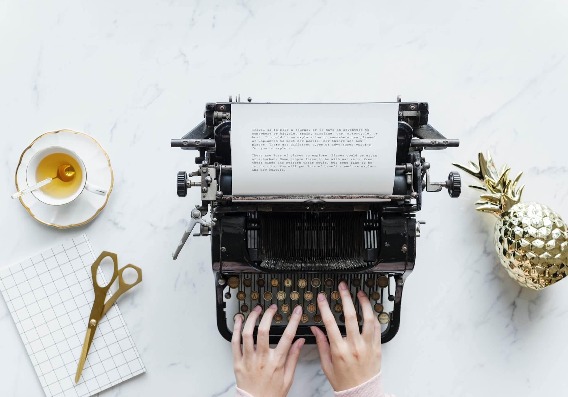 Person Typing on a Typewriter
