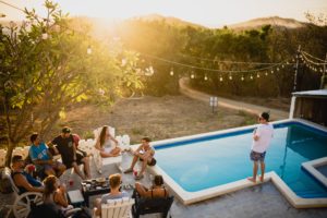 group standing next to a pool