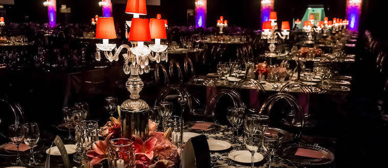 a dinning room with many tables all set