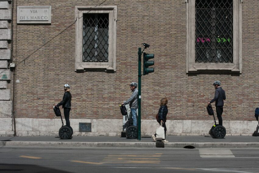 A group of people riding segways